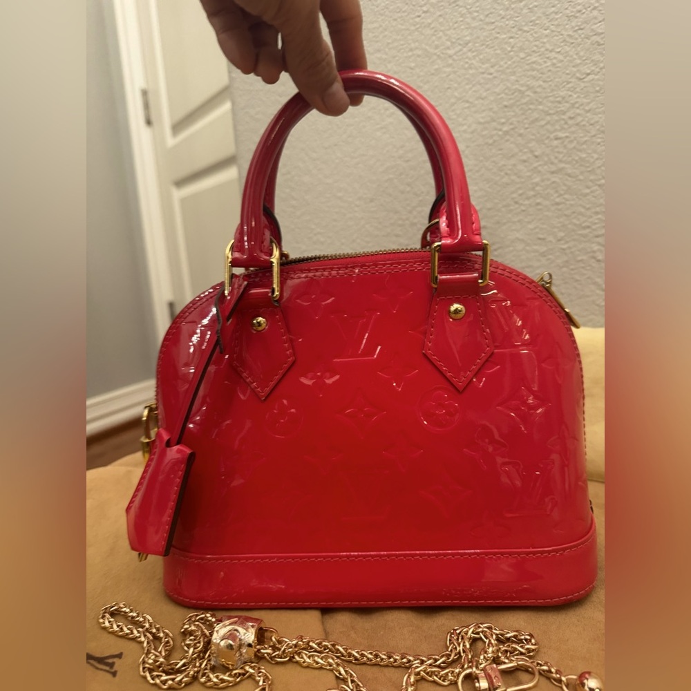 Louis Vuitton Alma BB Patent Leather Dome Bag
Hot pink